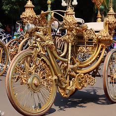 An elaborate and ornate bicycle, made for a grand parade or celebration.