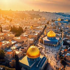 A bird's eye view of the beautiful city of Jerusalem at sunset, with its golden rooftops, domed temples and bustling streets.
