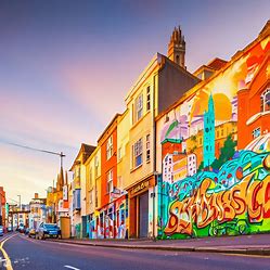 A) A colorful street mural of Bristol in the sunset light.