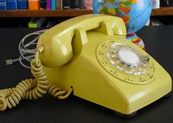 Image result for Yellow Dial Phone