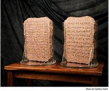 Image result for Man Carrying a Large Stone Tablet