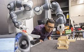 Image result for Person Working On Robot