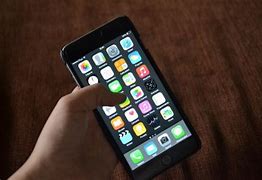 Image result for iPhone 6 Plus in Hand