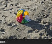 Image result for Deflated Beach Ball On Sand