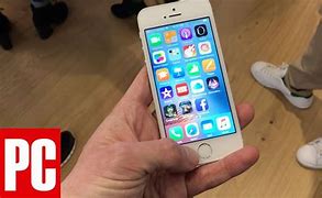 Image result for SE iPhone Holded in a Kids Hand