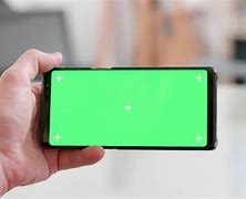 Image result for Person Holding iPhone 13 Mini