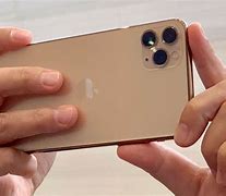 Image result for A Person Holding the iPhone 11