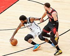 Image result for Kyrie Irving Crossover Nets Hand On Ground