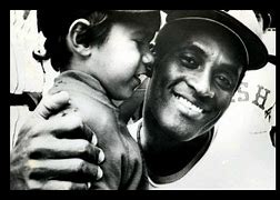 Image result for Roberto Clemente Helping Others