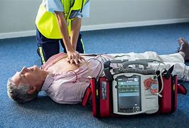 Image result for Man Applying AED Defibrillator