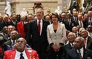 Image result for Joe Biden Giving Speech with Nancy Pelosi Smile Behind Him