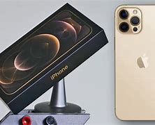 Image result for iPhone 12 Pro Max Box Holding Phone