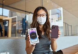 Image result for Person Holding an iPhone 14