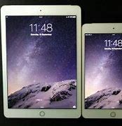Image result for iPad Mini Next to iPhone Plus