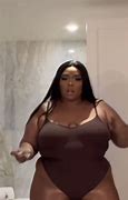 Image result for Lizzo in Bodysuit Cream and Purple