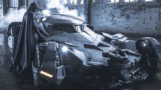 Image result for Images of Batman Feuling His Batmobile