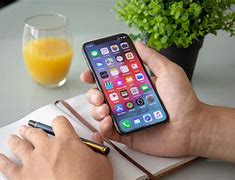Image result for Person Holding Out an iPhone