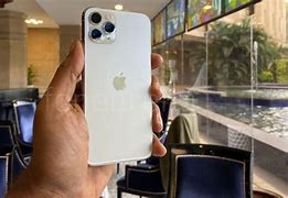 Image result for iPhone 11 Pro Box Next to the Apple Logo