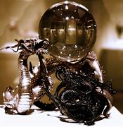 Image result for Dragon Wrapped around Crystal Ball