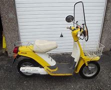 Image result for Yellow Yamaha Scooter