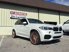 Image result for BMW X5 M Wrapped Rose Gold