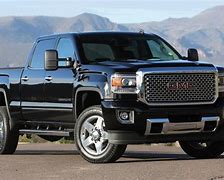 Image result for 2019 GMC Sierra Denali 3500HD Crew Cab Short Box 4x4 Red Lifted