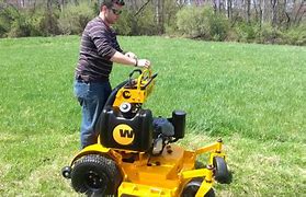 Image result for Standing Riding Lawn Mower