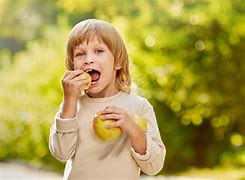 Image result for Kid Eating Apple Funny Face