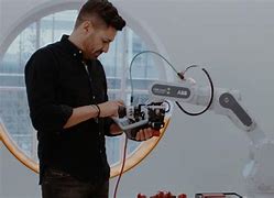 Image result for Man Working with Robot