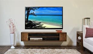 Image result for What Decor to Put Under Flat Screen TV On Wall