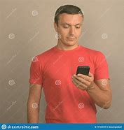 Image result for Man in Red Top with Phone