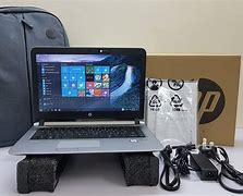 Image result for Laptop with It Box Beside