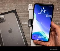 Image result for Holding iPhone 11 Pro
