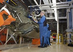 Image result for Auto Assembly Line Workers Group Photo