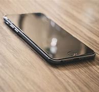 Image result for Apple Phone On Table