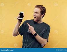 Image result for Actor Smiling at the Camera Holding Smartphone Meme