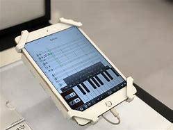 Image result for iPad Mini Ad Piano