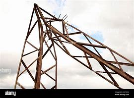 Image result for Broken Power Pole Held Together with Rope Near Sand