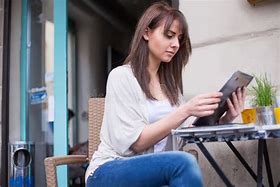 Image result for Lady Looking at iPad On Floor Wide Shot