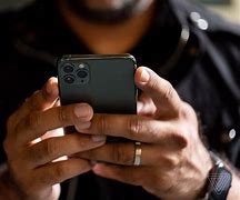 Image result for Black Hand Holding iPhone 13 Pro Max