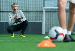 Image result for football coach and players