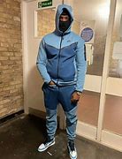 Image result for Blue Nike Tech On a Black Person