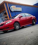 Image result for White Camry with Red Rims