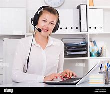 Image result for Person Working On Computer and in Phone Call