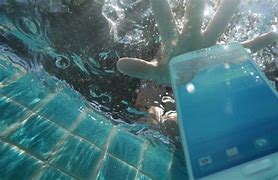 Image result for Reamle 7 Phone in Water Pic