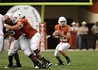 Image result for American Football Player Kicking Ball