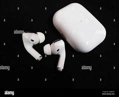 Image result for Air Pods While Charging the Case with Light