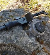 Image result for 50 Round Drum Shotgun