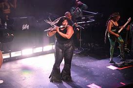 Image result for Lizzo Blowing a Flute