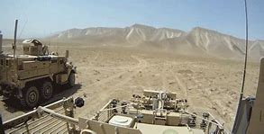 Image result for MRAP with RPG Netting